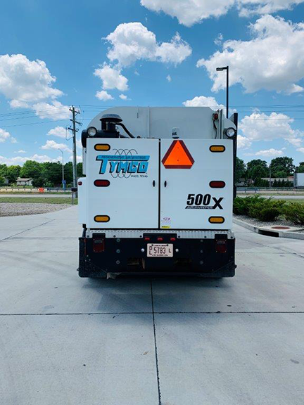 2006 TYMCO 500X Sweeper (#004146): Mounted on an International 4200 Chassis. Two Gutter Brooms - Drop Down and Hi/Low Pressure Wash Down. Act Now On This One! Rear view.